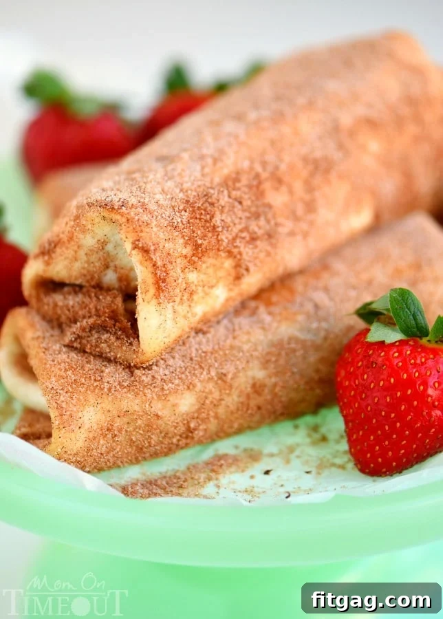 Crispy Chocolate Strawberry Cheesecake Chimis 3 Close-up of golden brown Chocolate Strawberry Cheesecake Chimichangas, ready to be enjoyed.