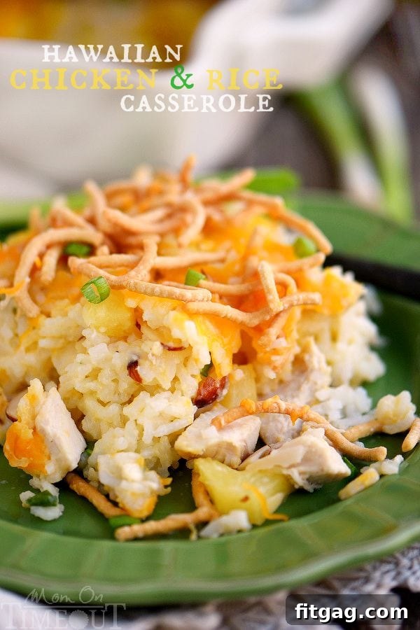A serving of Hawaiian Chicken and Rice Casserole, showcasing golden-brown topping and vibrant ingredients.