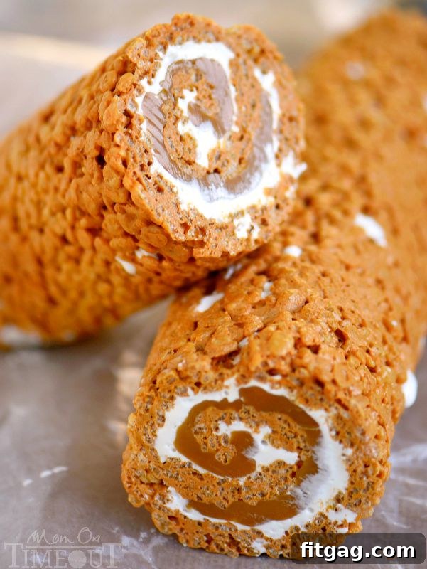 Close-up of a beautifully swirled Caramel Pumpkin Spice Rice Krispies Treats Pinwheel, showcasing the delicious layers of caramel and pumpkin spice.