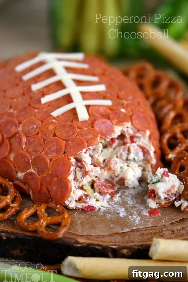 Touchdown Pepperoni Pizza Cheese Ball 2 This Pepperoni Pizza Football Cheese Ball is my new favorite thing! Super easy to make and a total showstopper! Make this for your next game day celebration and watch the crowd go wild!