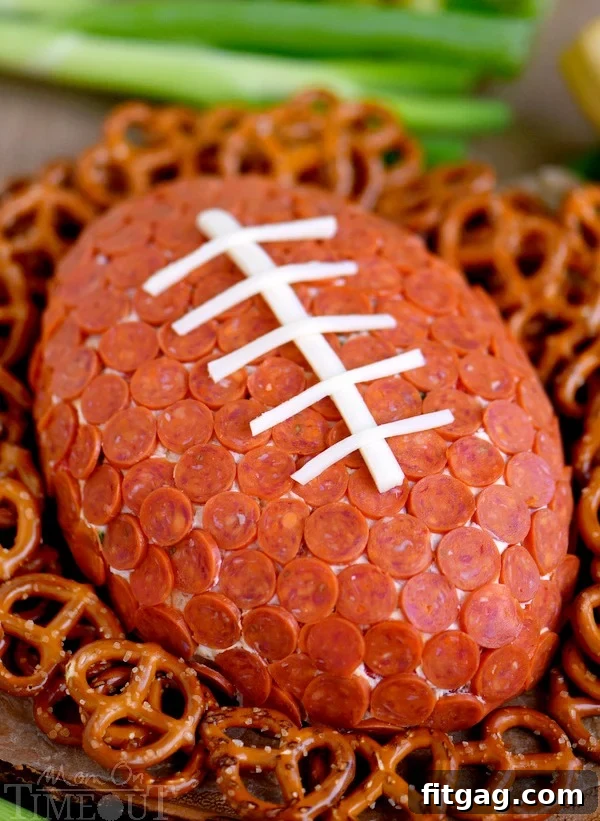 Touchdown Pepperoni Pizza Cheese Ball 5 This Pepperoni Pizza Football Cheese Ball is my new favorite thing! Super easy to make and a total showstopper! Make this for your next game day celebration and watch the crowd go wild!