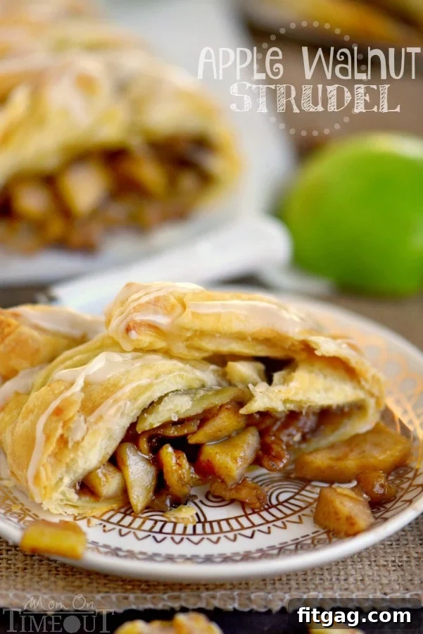 Golden-brown, flaky Apple Strudel, garnished with powdered sugar, ready to be served