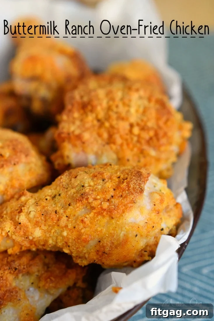 Oven-fried chicken pieces, seasoned with ranch and coated with a crispy breading, arranged on a baking sheet before cooking. Shows the preparation stage of the recipe.