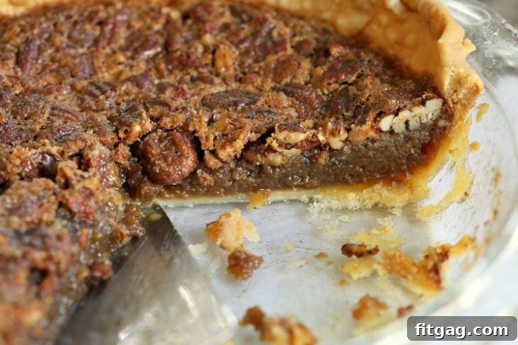 Decadent Brown Sugar Pecan Pie 5 A whole brown sugar pecan pie baked perfectly in a pie plate, ready to be cooled and served.
