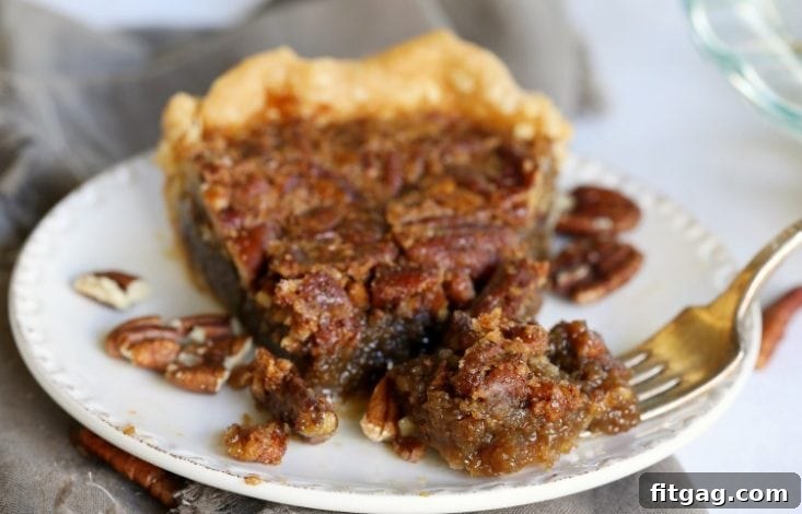 Decadent Brown Sugar Pecan Pie 8 A wide-angle shot of a baked brown sugar pecan pie recipe, showing the inviting texture and golden crust.