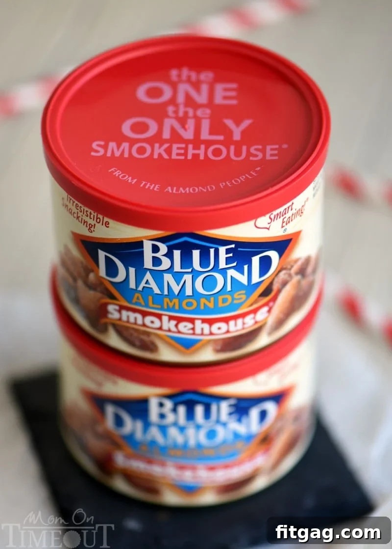 A container of Blue Diamond Smokehouse Almonds, highlighting the key ingredient for the cheese ball's crispy coating.