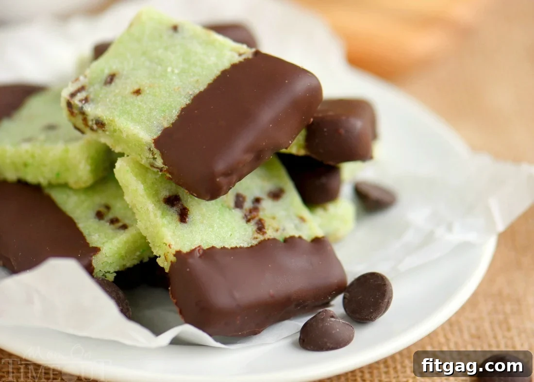 Delightfully easy Chocolate Dipped Mint Shortbread Cookies are perfect for the holidays! Mint and chocolate is the BEST combination and it really shines through in these buttery cookies!