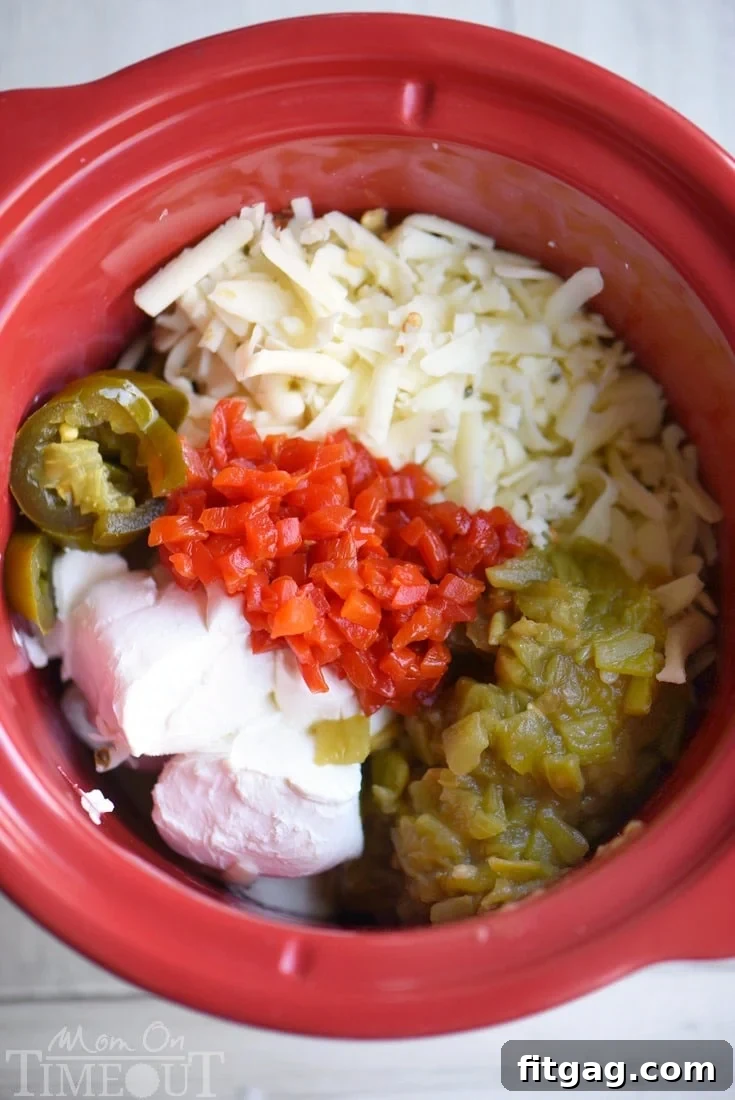 Creamy Slow Cooker Queso Blanco melting in a crockpot