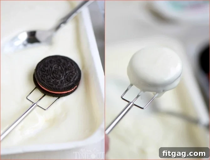 Close-up demonstrating the technique of drizzling chocolate over a dipped Oreo on a three-pronged tool.