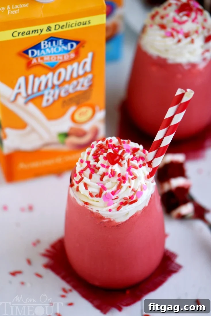This Skinny Red Velvet Shake is the perfect treat for Valentine's Day or whenever you need a little something special. Topped with a decadent cream cheese whipped cream, this skinny shake is hard to resist! Great for breakfast or dessert!