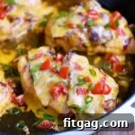 Smoky Rancher's Chicken Bake 2 four servings of monterey chicken still in the skillet with diced tomatoes and green onions scattered on top for garnish.