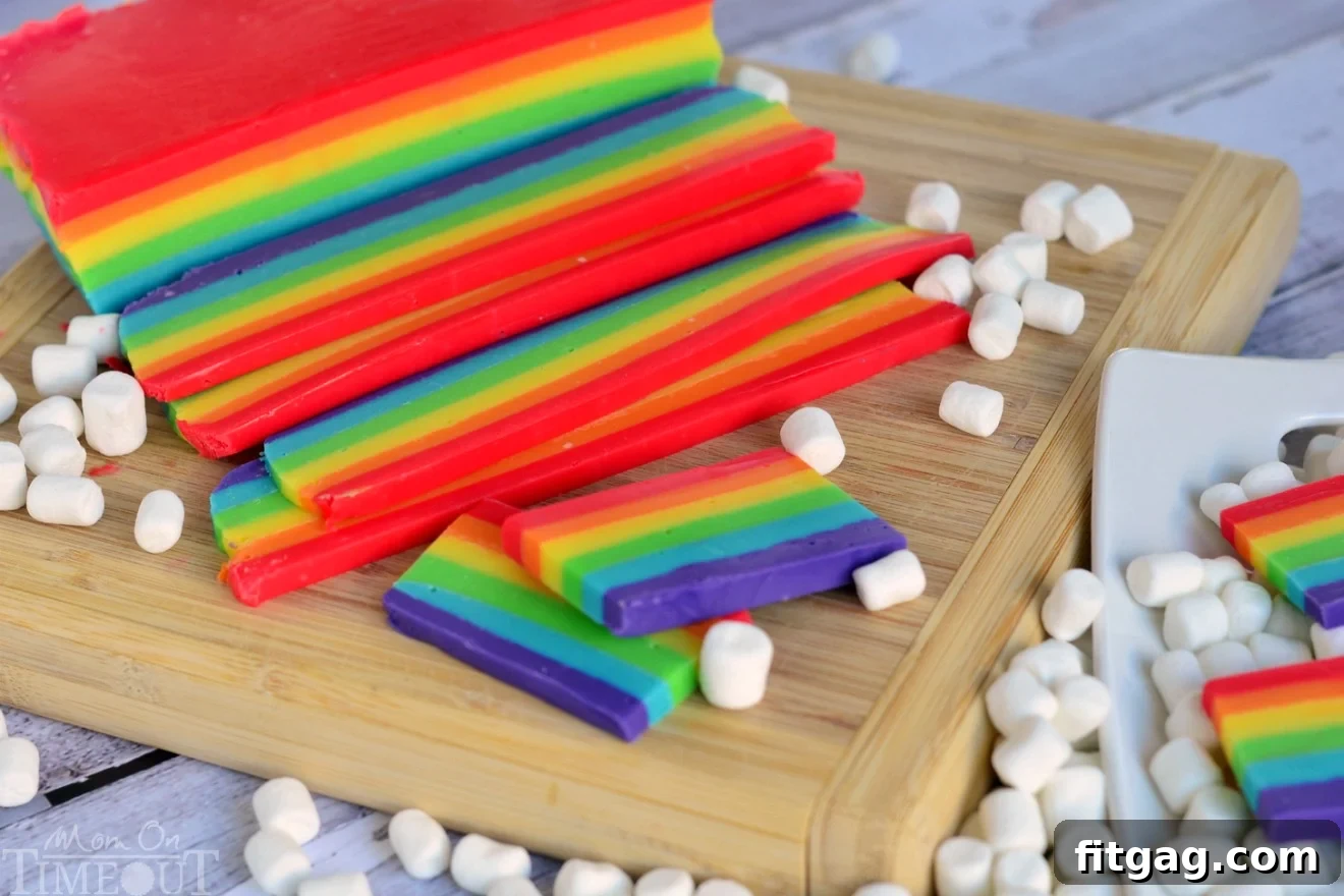 Close-up of rainbow fudge showing vibrant, distinct layers and a smooth texture.