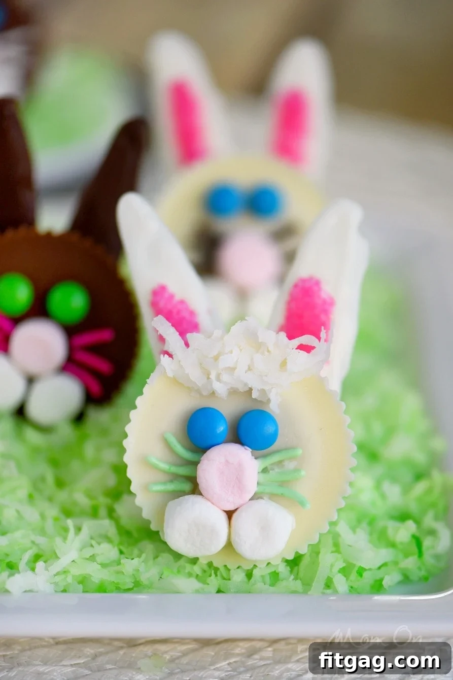 Reese's Easter Bunny Treats 7 A colorful collection of finished Reese's Easter Bunnies with various colored features, ready for Easter celebrations.