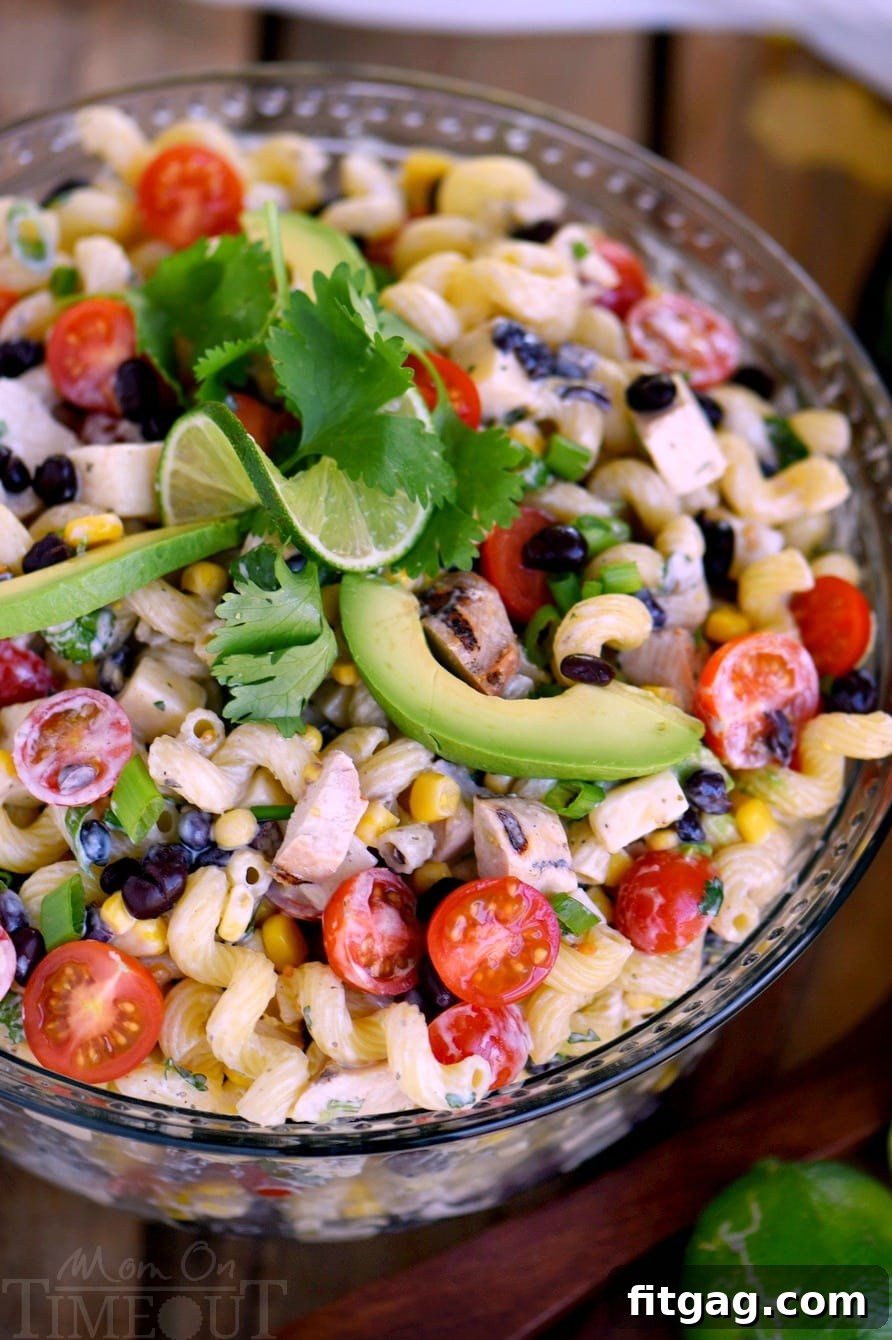 This Creamy Cilantro Lime Southwestern Pasta Salad recipe is satisfying enough for an easy dinner or a tasty addition to any party, BBQ or get together! Grilled chicken, black beans, corn, tomatoes, and a creamy cilantro lime dressing make this pasta salad exceptionally delicious!