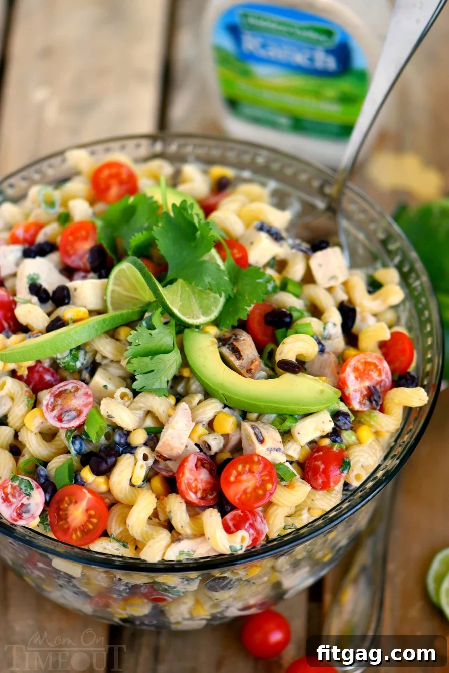 This Creamy Cilantro Lime Southwestern Pasta Salad recipe is satisfying enough for an for an easy dinner or a tasty addition to any party, BBQ or get together! Grilled chicken, black beans, corn, tomatoes, and a creamy cilantro lime dressing make this pasta salad exceptionally delicious!