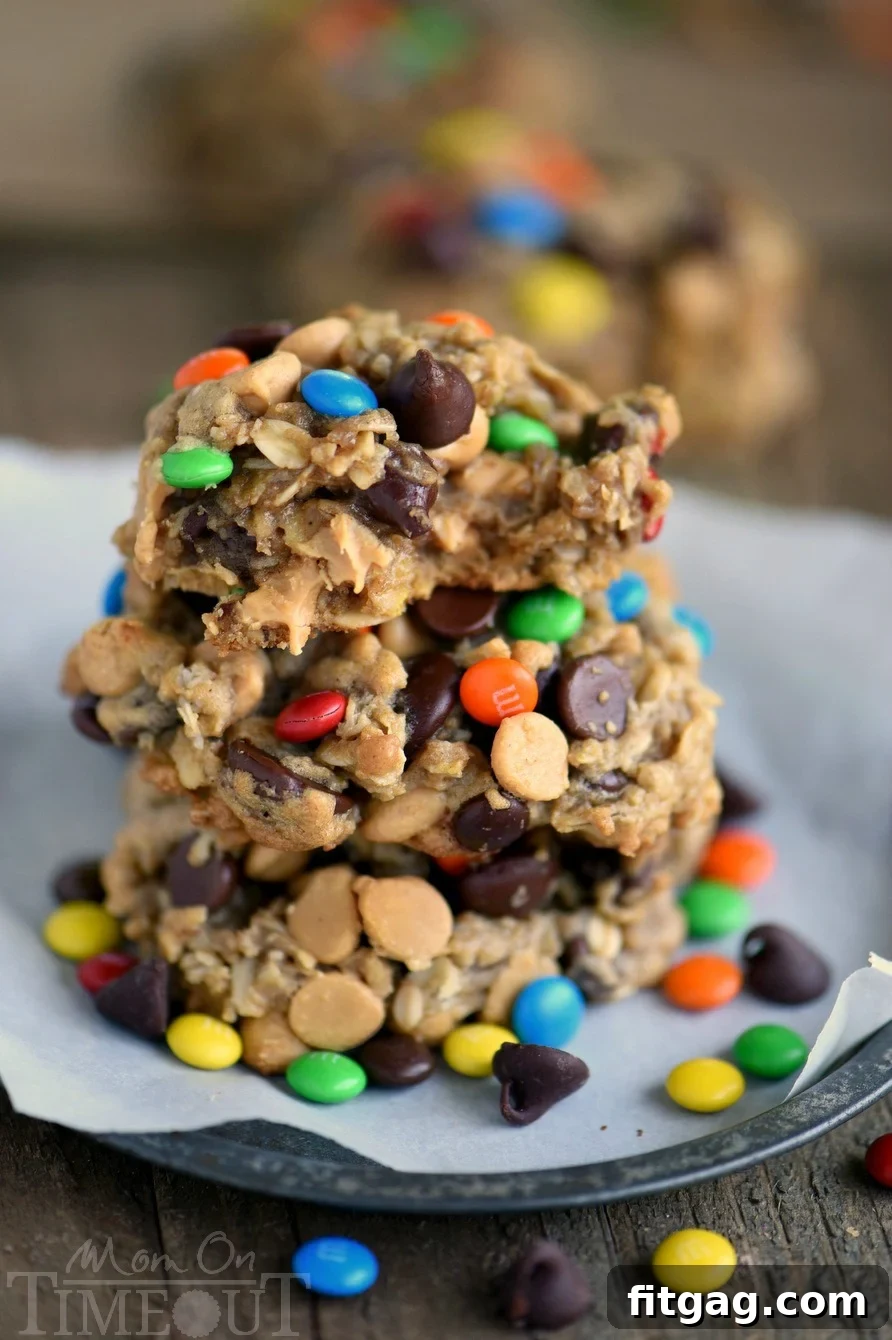 Epic Peanut Butter Oatmeal Cookies 4 A Monster Peanut Butter Oatmeal Cookie with a bite taken out, revealing the soft, chewy interior and abundant mix-ins.