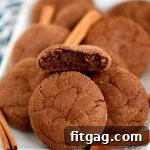 A plate full of golden brown Mexican Chocolate Snickerdoodles, perfectly crinkled and ready to be served.