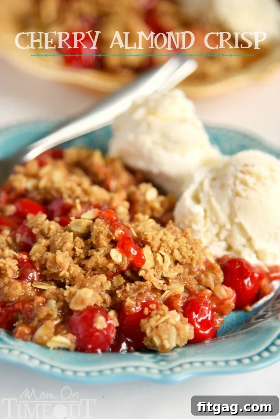 Easy Cherry Almond Crisp with Vanilla Ice Cream A warm, bubbly Easy Cherry Almond Crisp served with two scoops of melting vanilla ice cream, promising a delightful dessert experience for friends and family. This easy dessert is sure to become a new favorite.