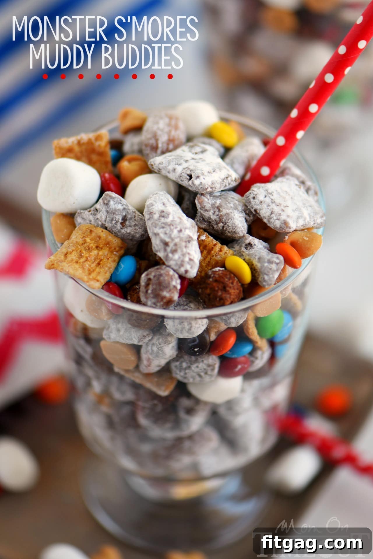 A vibrant mix of Monster S'mores Muddy Buddies, showcasing chocolate-coated cereal, roasted almonds, and mini marshmallows.
