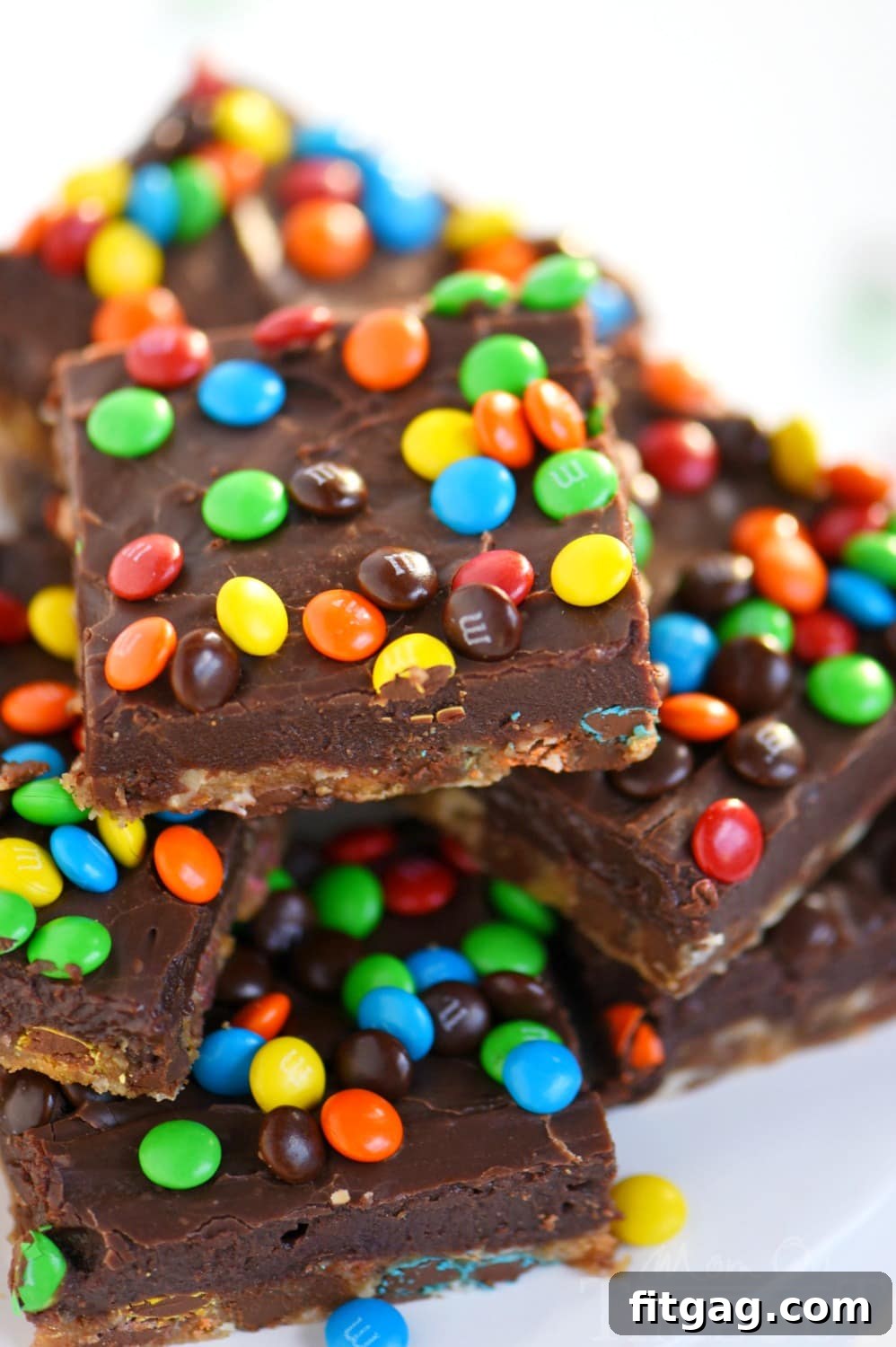 Perfectly portioned Monster Fudge Bars, showcasing their rich, layered texture and vibrant M&M's, ready to be served as a delightful treat.