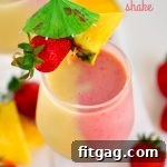 Neon Sunset Slim Smoothie 7 A beautifully layered Skinny Miami Vice Shake, showcasing the vibrant colors and enticing texture of this refreshing summer drink.