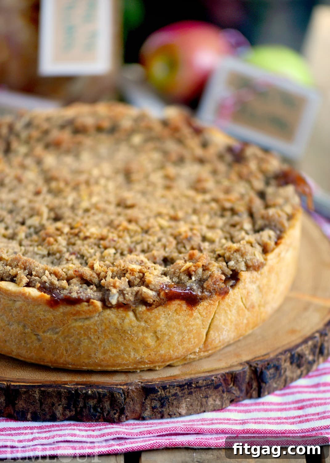 Homestyle Deep Dish Dutch Apple Pie 3 Close-up of a slice of Deep Dish Dutch Apple Pie with apple filling and streusel topping.