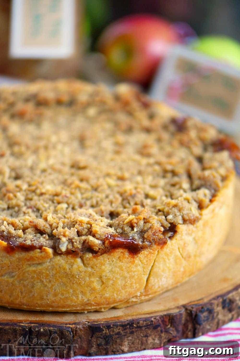 Homestyle Deep Dish Dutch Apple Pie 6 Serving a slice of Deep Dish Dutch Apple Pie with vanilla ice cream and caramel sauce.