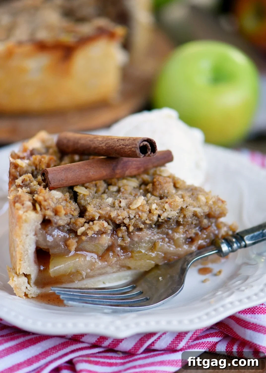 Homestyle Deep Dish Dutch Apple Pie 7 Full Deep Dish Dutch Apple Pie with a scoop missing, highlighting the rich filling and streusel.
