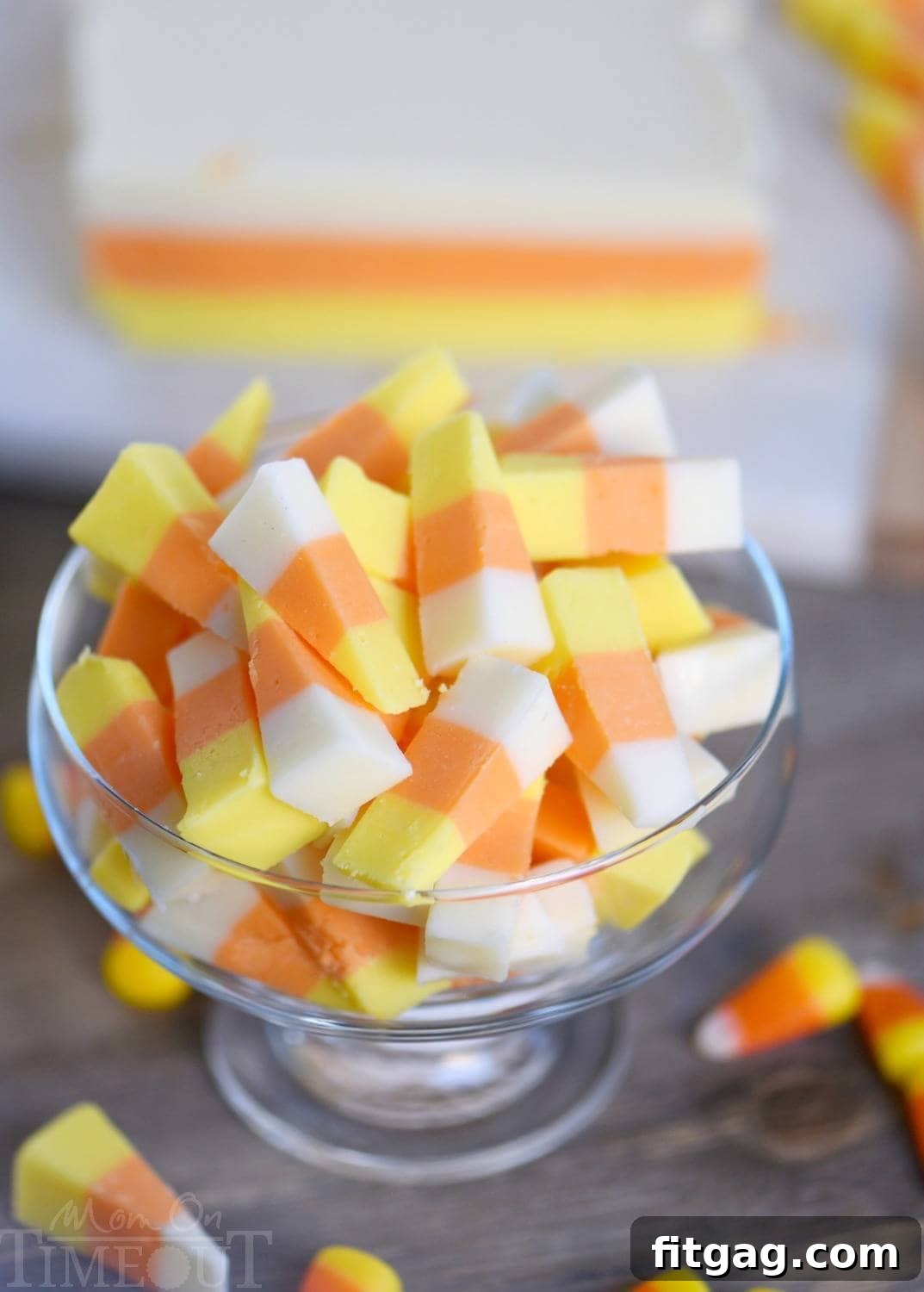 No-Bake Candy Corn Fudge Bliss 3 A stunning array of finished Candy Corn Fudge pieces, cut into perfect triangles, ready to serve as a festive Halloween treat.