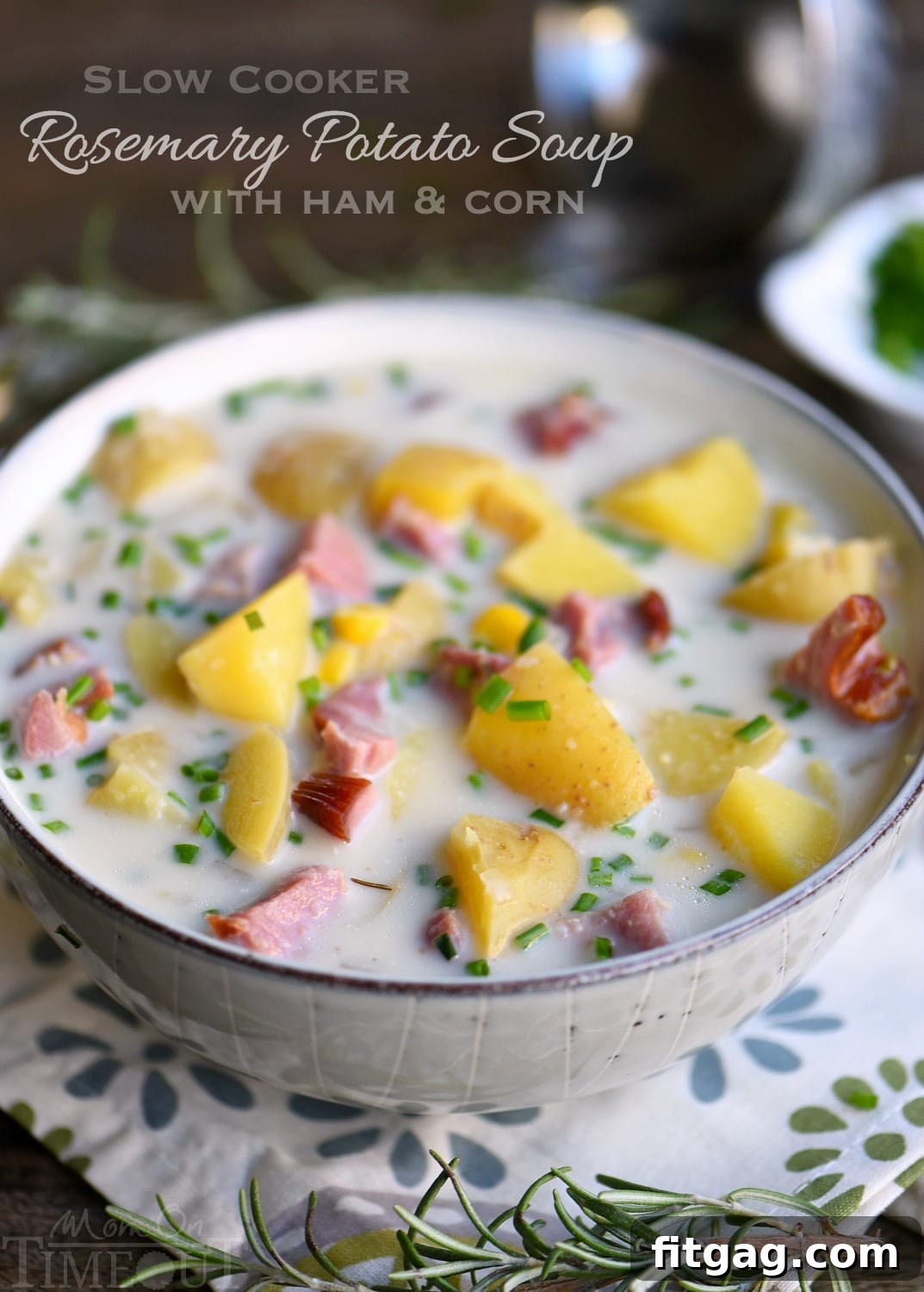Cozy Slow Cooker Rosemary Ham Potato and Corn Soup 2 A steaming bowl of Slow Cooker Rosemary Potato Soup with Ham and Corn, garnished with fresh chives, promises comfort and deliciousness for weeknight dinners.