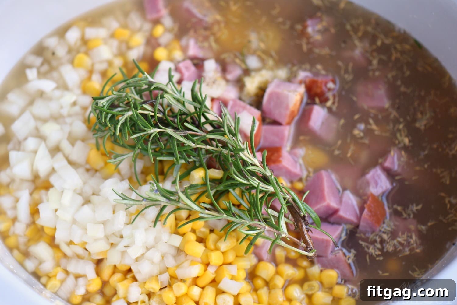 Cozy Slow Cooker Rosemary Ham Potato and Corn Soup 3 Close-up of the Slow Cooker Rosemary Potato Soup with Ham and Corn, showcasing its creamy texture and rich ingredients.