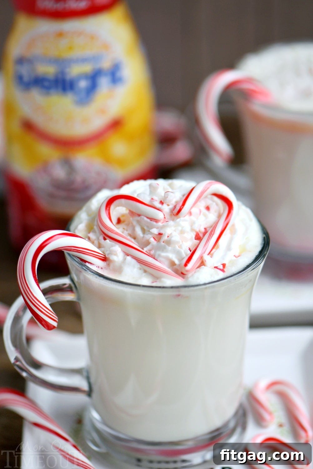 Creamy Peppermint White Hot Chocolate Slow Cooker Delight 3 Creamy and decadent Slow Cooker Peppermint White Hot Chocolate! This easy recipe is the perfect way to warm up on a chilly day! Top with whipped cream and crushed candy canes for the ultimate peppermint experience! // Mom On Timeout