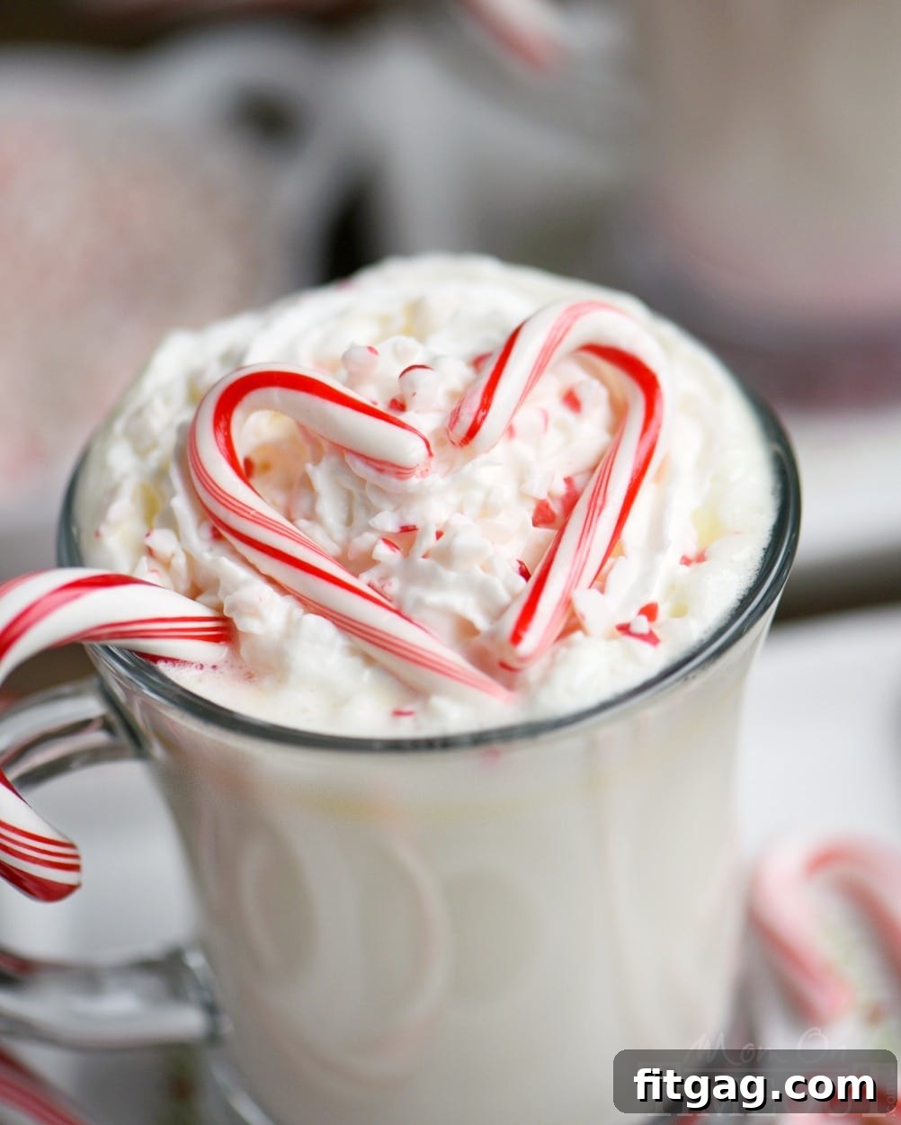 Creamy Peppermint White Hot Chocolate Slow Cooker Delight 5 Creamy and decadent Slow Cooker Peppermint White Hot Chocolate! This easy recipe is the perfect way to warm up on a chilly day! Top with whipped cream and crushed candy canes for the ultimate peppermint experience! // Mom On Timeout
