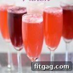 Sparkling Berry Celebration 6 A glass of Berry Champagne Punch with fresh berries and sparkling wine
