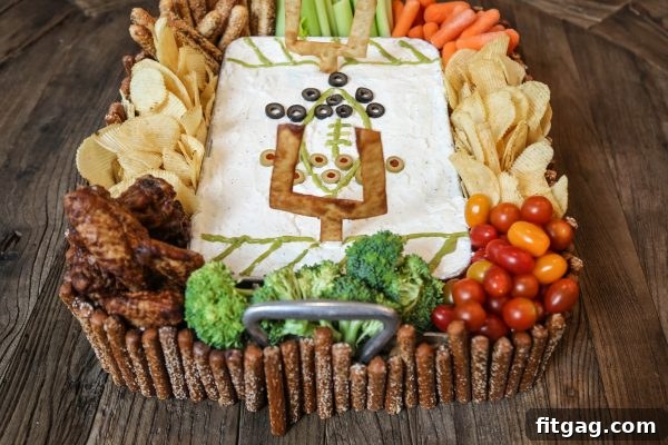 A simple yet effective snack stadium setup, utilizing rectangular containers for dips and snacks, arranged for easy access during a game.
