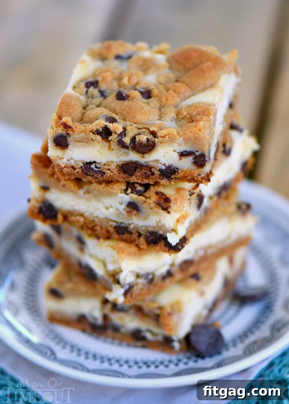 Mom On Timeout's 5-ingredient Chocolate Chip Cookie Cheesecake Bars: a delightful and easy dessert recipe. Overhead view of Chocolate Chip Cookie Cheesecake Bars in a baking pan, ready to be cut.