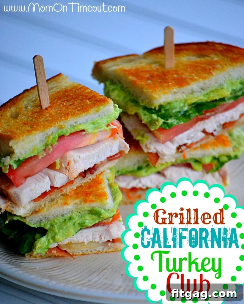 A closer look at a cut Grilled California Turkey Club sandwich, revealing perfectly layered turkey, crispy bacon, creamy avocado, melted Swiss cheese, fresh lettuce, and ripe tomato on toasted sourdough bread