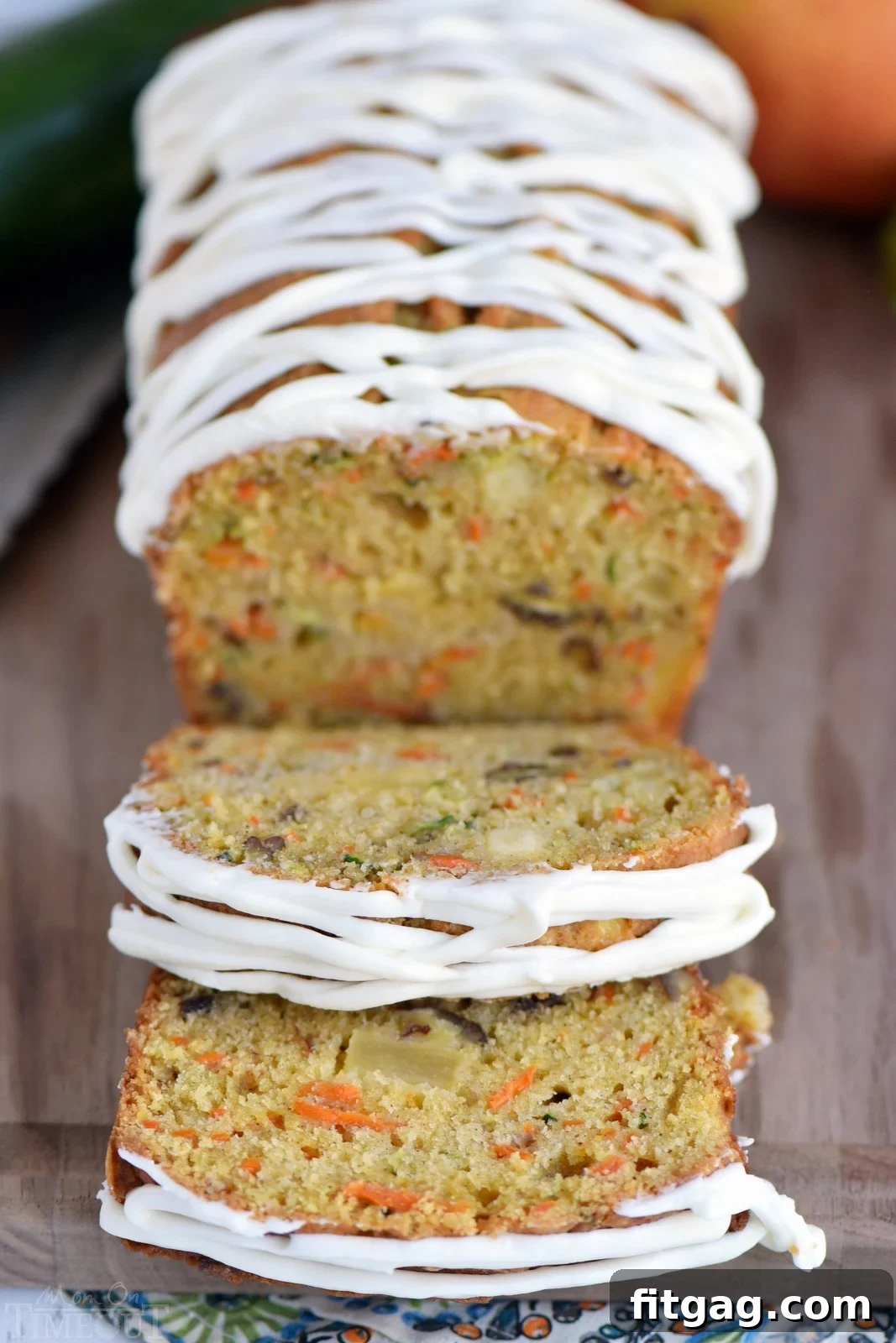 Close-up of a slice of Carrot Apple Zucchini Bread, showing its moist texture and colorful ingredients.
