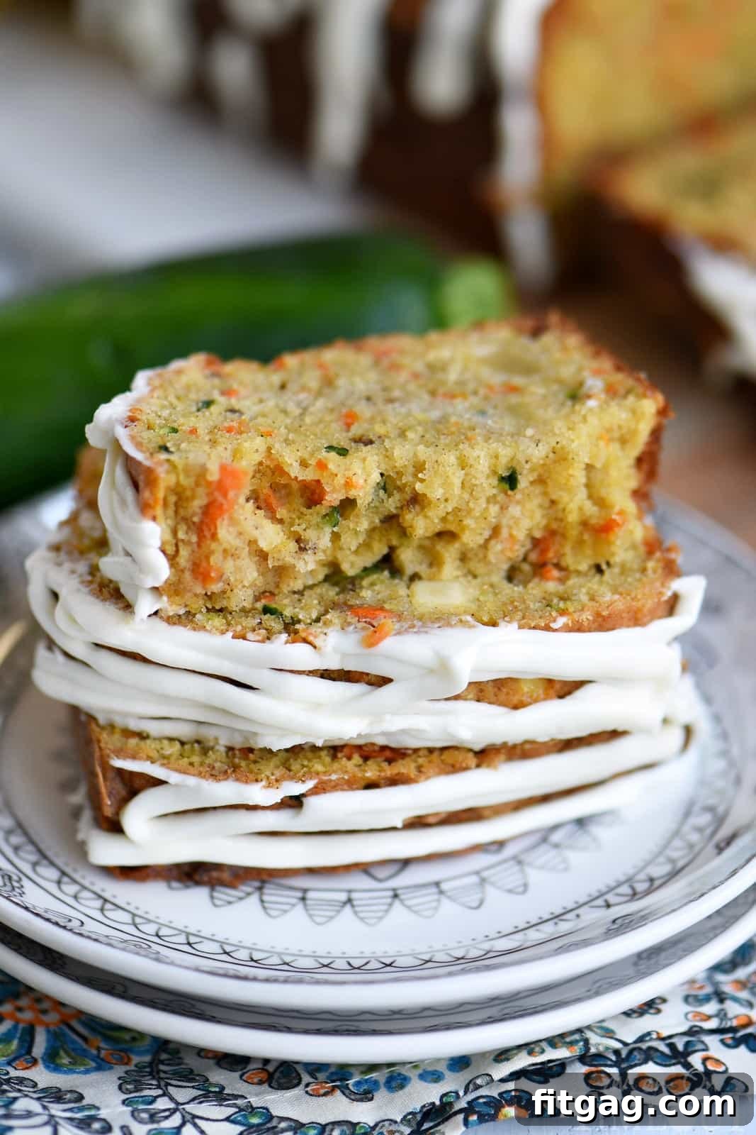 Two freshly baked loaves of Carrot Apple Zucchini Bread cooling on a wire rack.