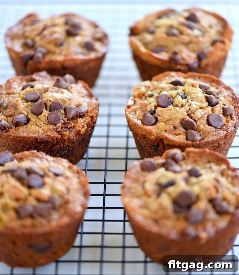 Close-up of freshly baked Jumbo Chocolate Chip Toffee Banana Muffins with chocolate chips and toffee bits