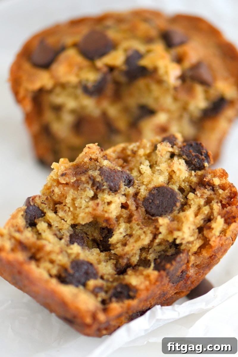 Stack of golden brown Jumbo Chocolate Chip Toffee Banana Muffins