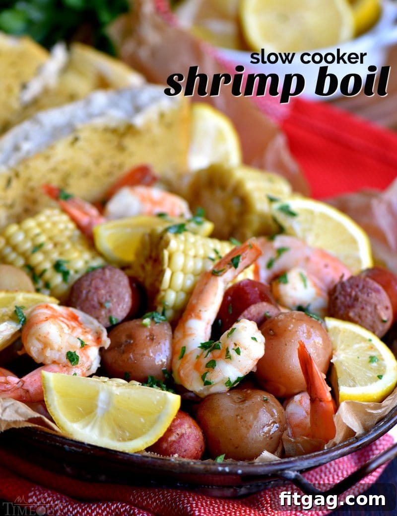 Easy Slow Cooker Shrimp Boil featuring shrimp, sausage, potatoes, and corn in a vibrant display, garnished with fresh lemon wedges, ready for a delicious family meal.