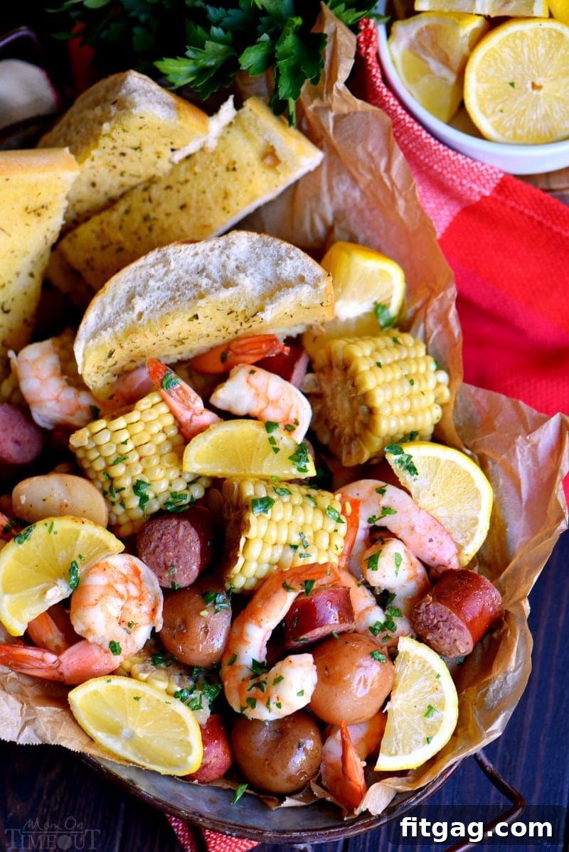 Old Bay Shrimp Boil served in a rustic basket with fresh lemon wedges and a generous side of toasted garlic bread, creating an inviting and delicious feast.