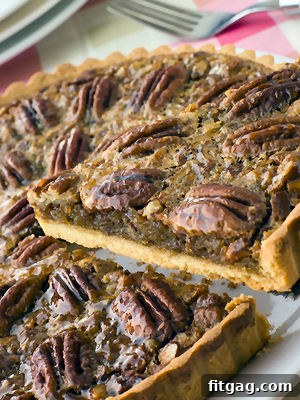 Rustic Maple Pecan Tart, featuring whole pecans and a golden crust.