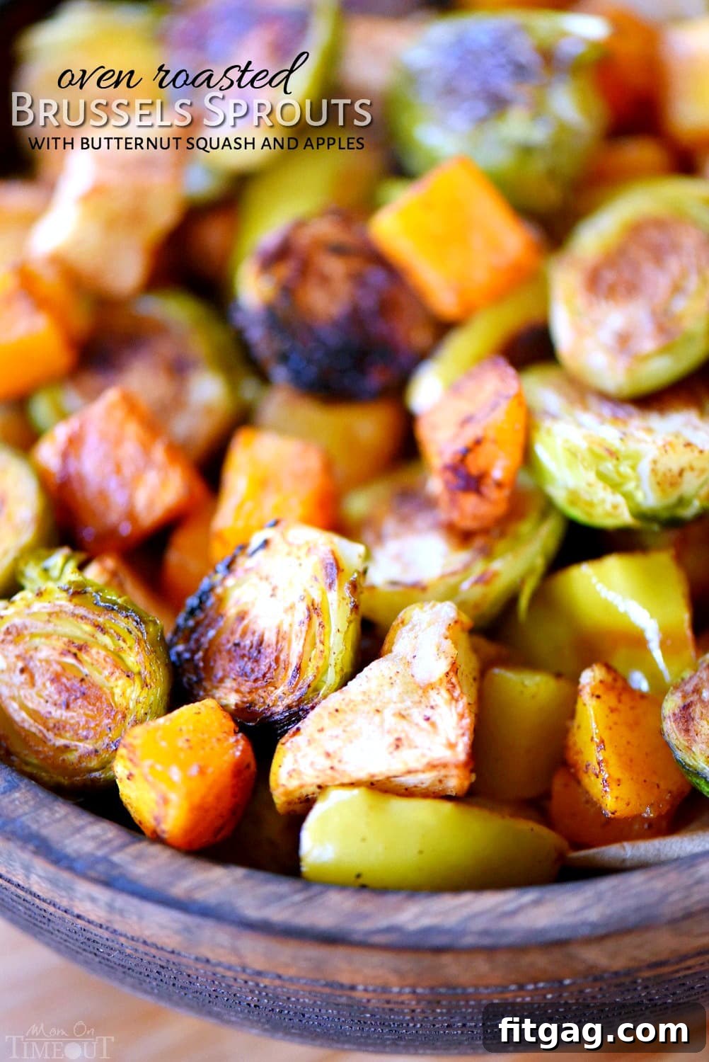 Oven Roasted Brussels Sprouts with Butternut Squash and Apples, a perfect fall and holiday side dish oven roasted brussels sprouts recipe in serving bowl with butternut squash and apples