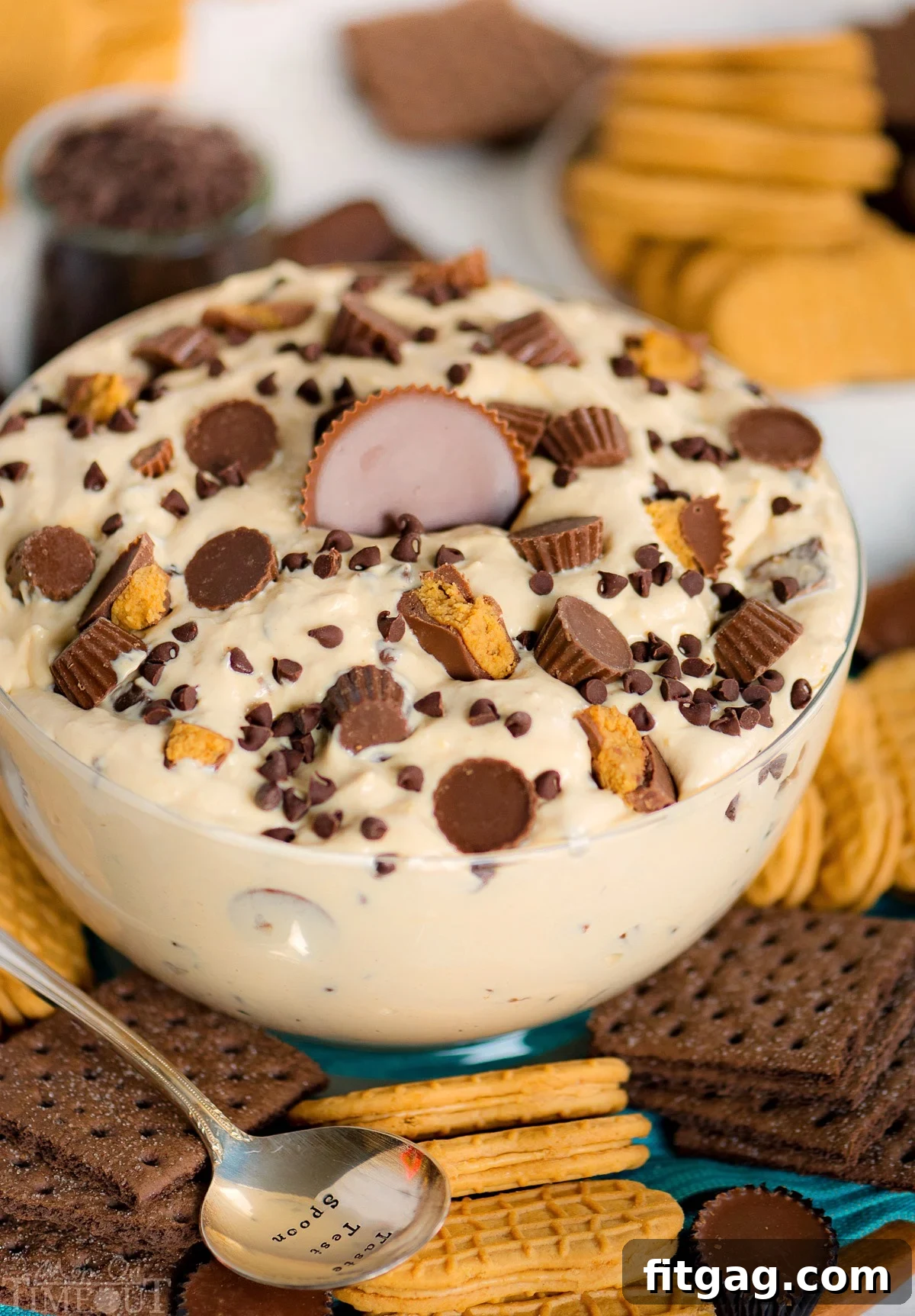Close-up of peanut butter fluff dip with Reese's candies, ready to be served.