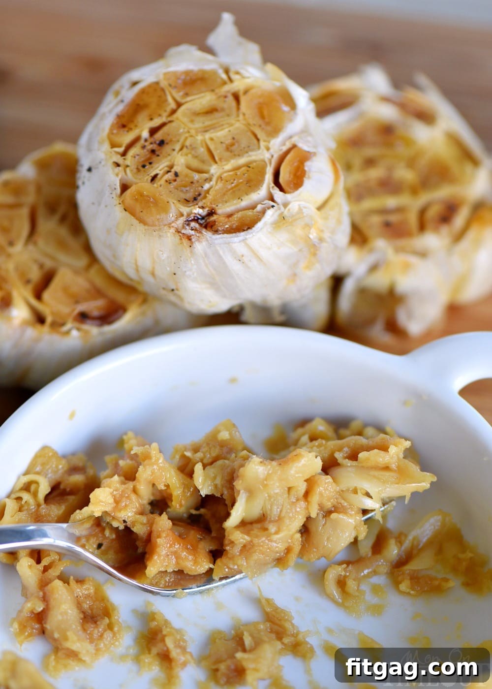 Perfect Roasted Garlic Made Easy 4 Creamy, golden roasted garlic paste in a small bowl, ready for use.