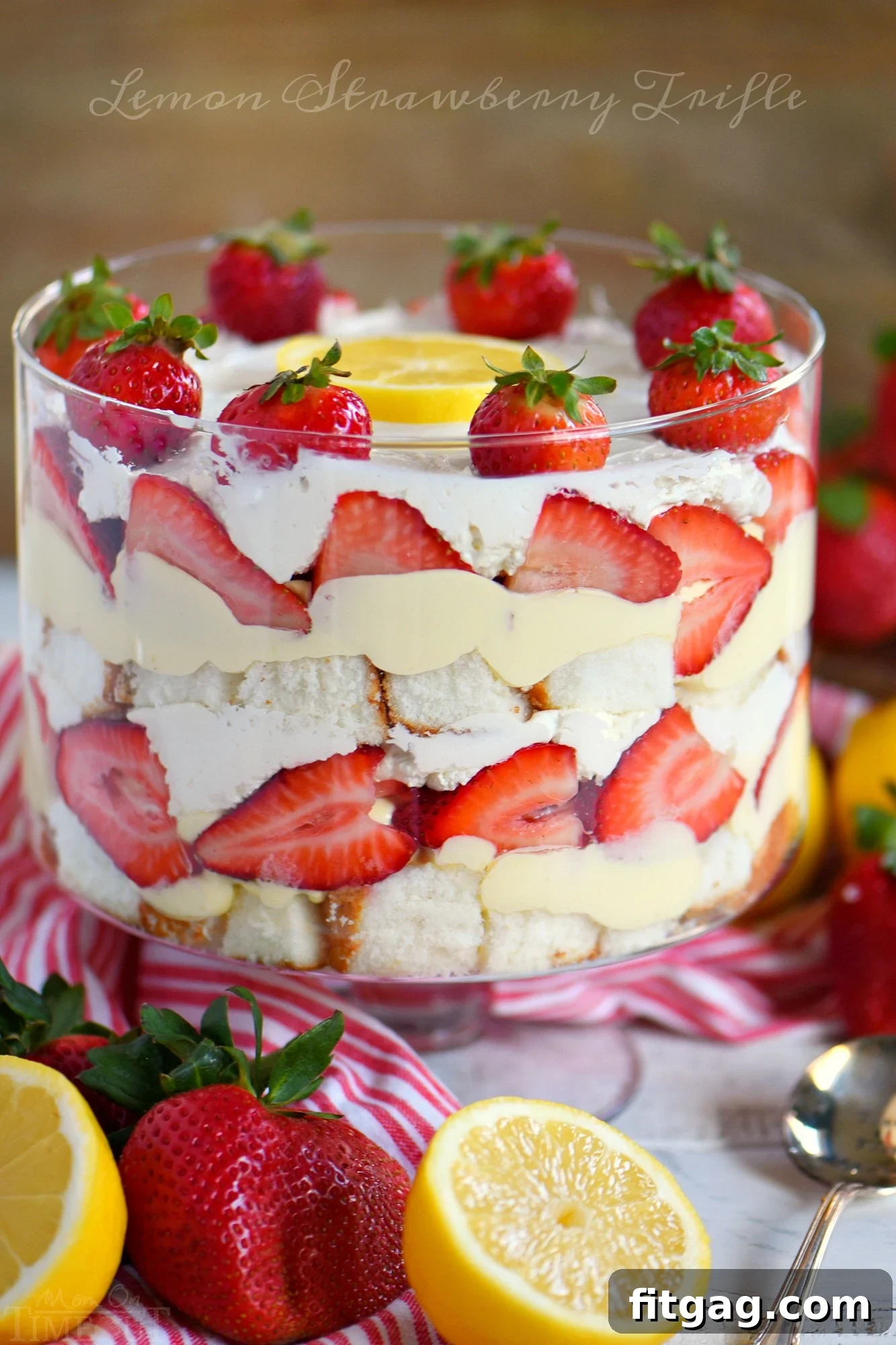 This Lemon Strawberry Trifle is what dreams are made of! An easy, no bake trifle recipe that is loaded with fresh strawberries, angel food cake, and lemon pudding - sure to be the highlight of your party! Perfect for easy entertaining during spring and summer! // Mom On Timeout #ad easy-strawberry-trifle-recipe