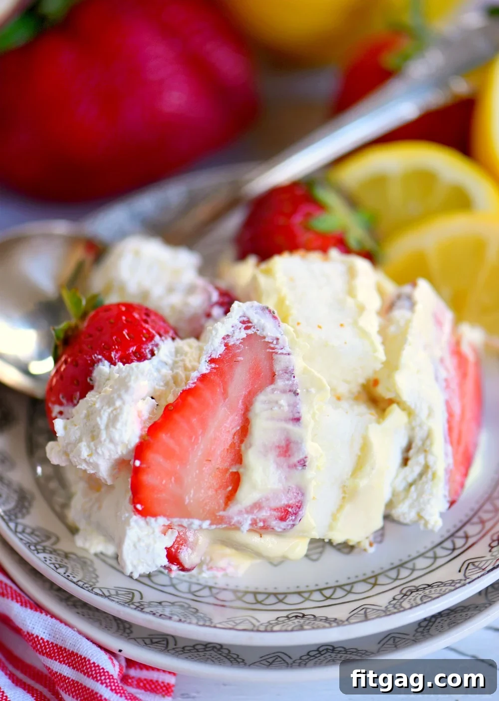 This Lemon Strawberry Trifle is what dreams are made of! An easy, no bake trifle recipe that is loaded with fresh strawberries, angel food cake, and lemon pudding - sure to be the highlight of your party! Perfect for easy entertaining during spring and summer! // Mom On Timeout #strawberry #lemon #trifle strawberry-trifle-lemon-curd