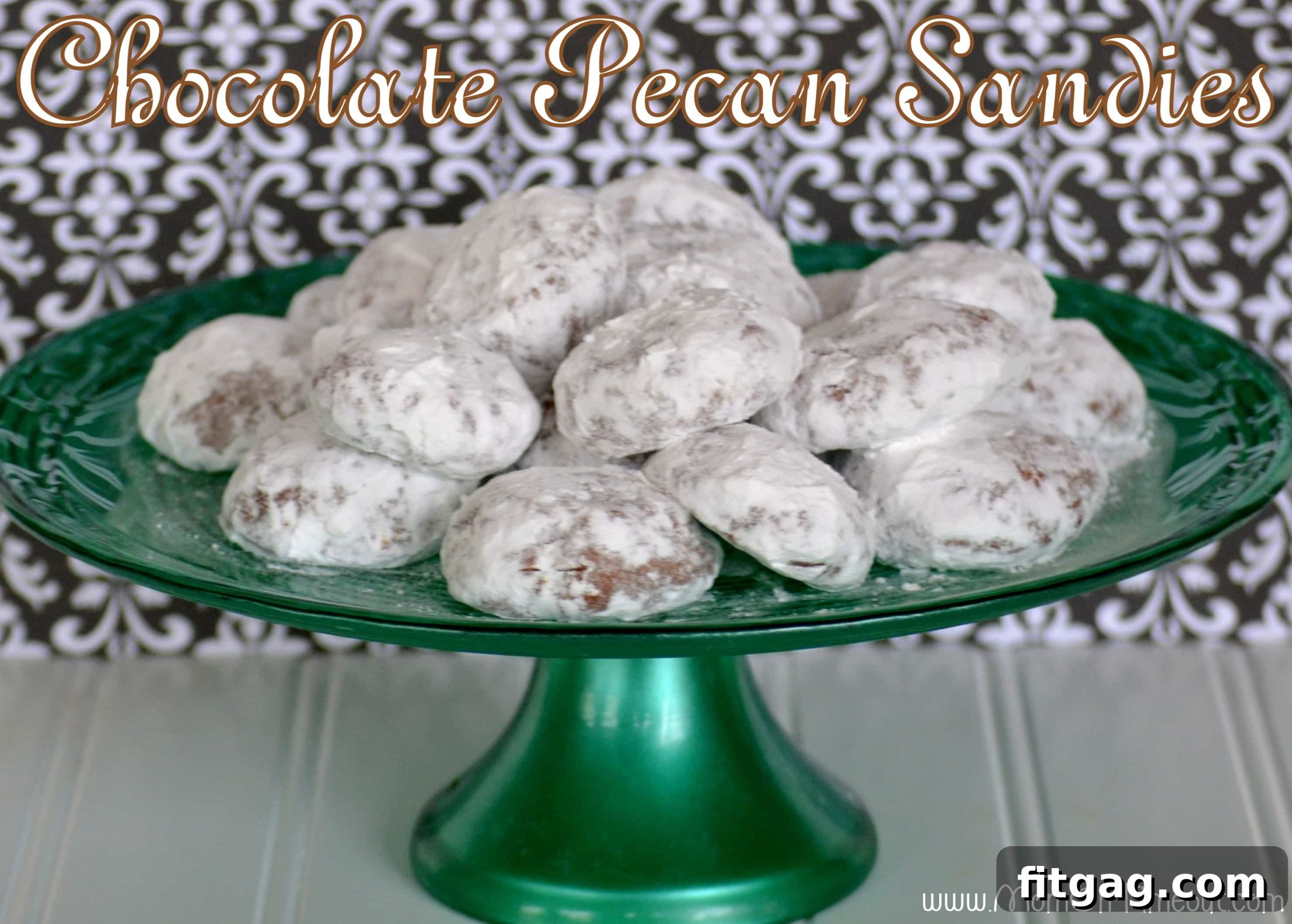 Chocolate Pecan Sandies | Mom On Timeout - Snowy white on the outside and chocolaty on the inside – a yummy twist on the original! #cookies #recipes #desserts Chocolate Pecan Sandies - Snowy white exterior with a rich chocolate and pecan interior for a delicious surprise.